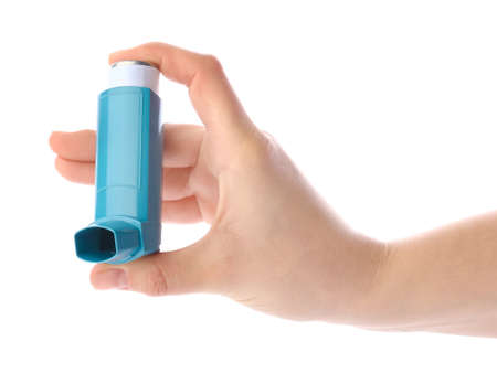 Female hand with inhaler on white backgroundの写真素材