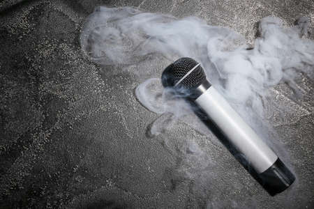 Modern microphone on dark backgroundの写真素材
