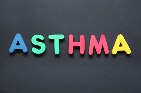 Word ASTHMA on dark backgroundの写真素材