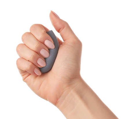 Hand with makeup sponge on white backgroundの写真素材