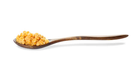 Spoon with tasty cooked lentils on white backgroundの写真素材