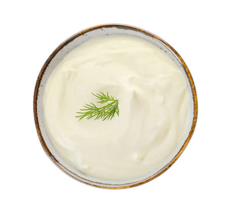 Bowl of tasty sour cream on white backgroundの写真素材