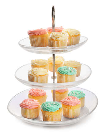 Dessert stand with tasty cupcakes on white background