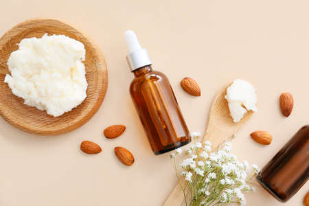 Bottles of almond essential oil on light backgroundの写真素材