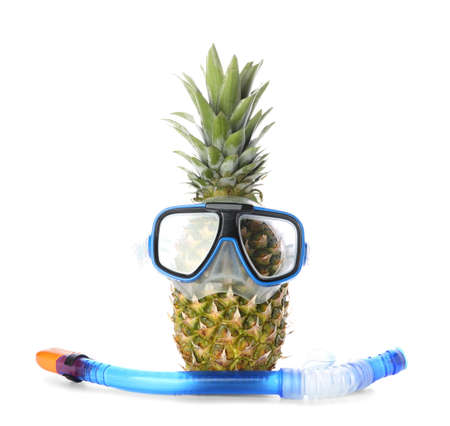 Fresh pineapple in snorkeling mask and tube on white backgroundの写真素材