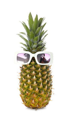 Funny pineapple in sunglasses on white backgroundの写真素材