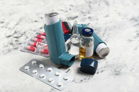 Inhalers and medicines on grunge backgroundの写真素材