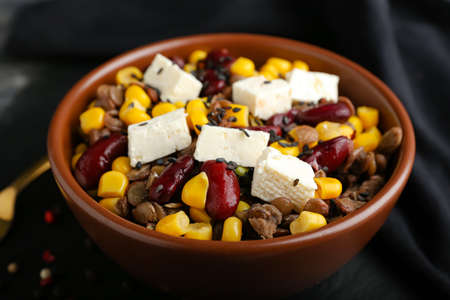 Bowl of tasty cooked lentils, beans and cheese on tableの写真素材
