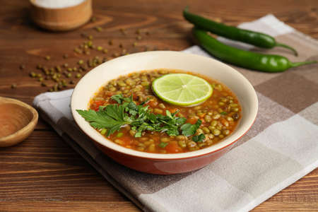Bowl of tasty lentil soup on tableの写真素材