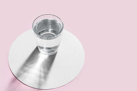 Glass of water on color backgroundの写真素材