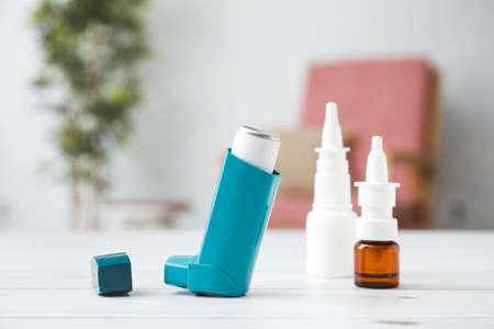 Modern inhaler on table at homeの写真素材