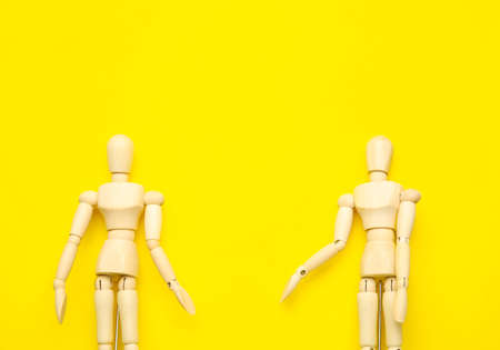 Wooden mannequins on color backgroundの写真素材