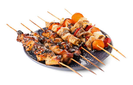 Grilled chicken skewers on white backgroundの写真素材