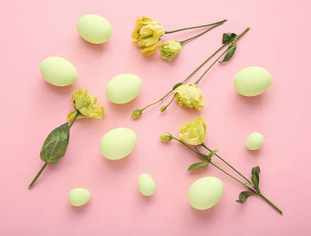 Composition with beautiful Easter eggs on color background