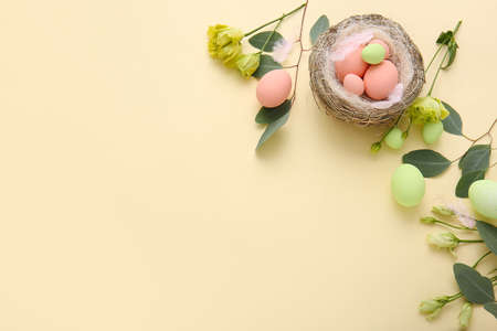 Composition with beautiful Easter eggs on color background