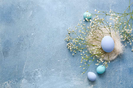 Composition with beautiful Easter eggs on color background