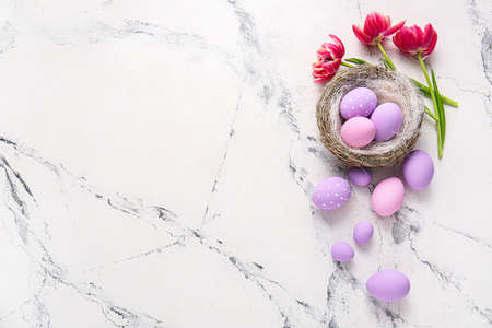 Composition with beautiful Easter eggs on light backgroundの写真素材