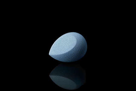 Makeup sponge on dark backgroundの写真素材