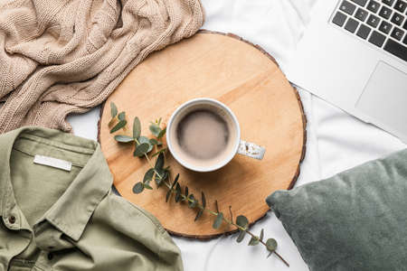 Composition with cup of coffee on bedの写真素材