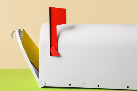 Mail box with letter on color backgroundの写真素材