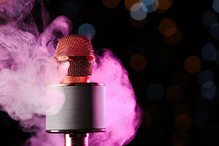 Modern microphone against defocused lights, closeupの写真素材