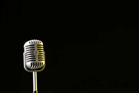 Retro microphone on dark backgroundの写真素材