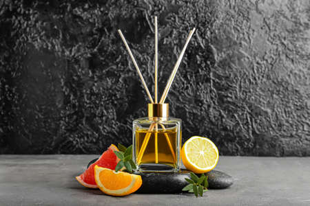 Citrus reed diffuser on dark background