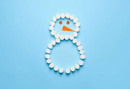 Funny snowman made of marshmallows on color background