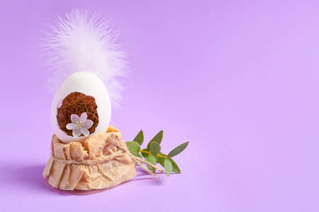 Creative composition with Easter egg on color background