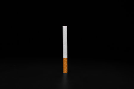 Cigarette on dark background. Concept of bad habitの写真素材