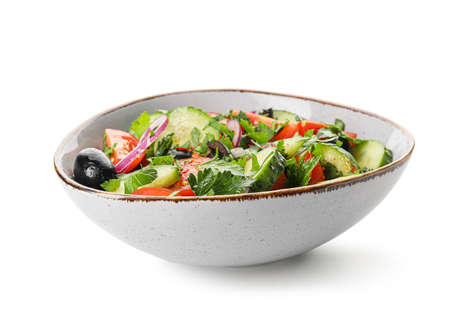 Bowl of fresh salad with vegetables on white backgroundの写真素材