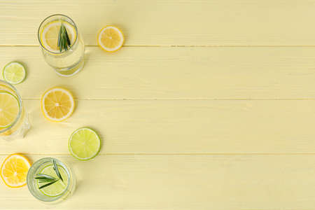 Glasses of healthy lemonade on color wooden backgroundの写真素材