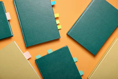 Books with bookmarks on color backgroundの写真素材