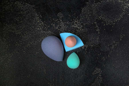 Makeup sponges on dark background