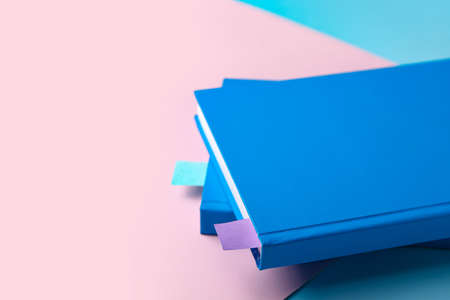Books with bookmarks on color background, closeupの写真素材