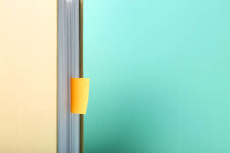 Book with bookmarks on color background, closeupの写真素材
