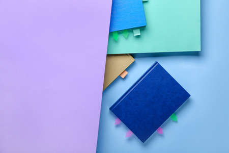 Books with bookmarks on color backgroundの写真素材