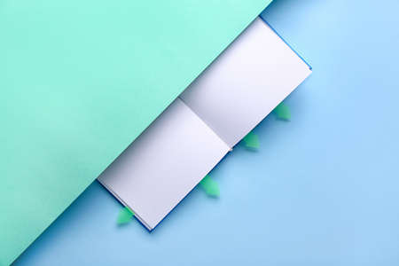 Book with bookmarks on color backgroundの写真素材