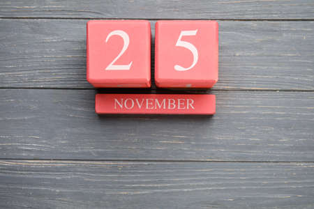 Calendar with date of November 25 on gray wooden backgroundの写真素材