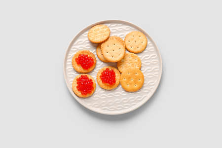 Tasty crackers with red caviar on gray backgroundの写真素材