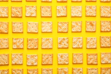 Tasty crackers on color backgroundの写真素材