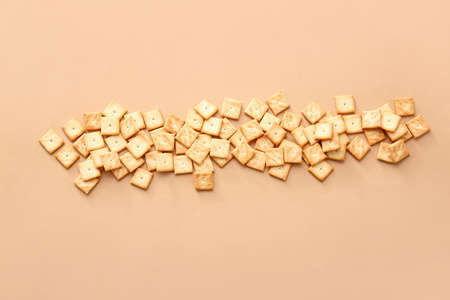 Tasty crackers on color backgroundの写真素材