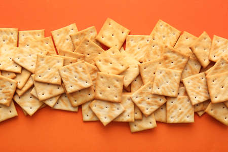 Tasty crackers on color backgroundの写真素材
