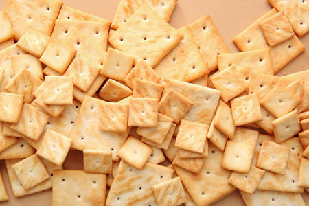 Tasty crackers on color background, closeupの写真素材