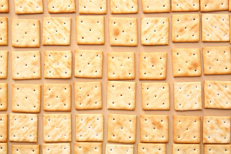 Tasty crackers on color backgroundの写真素材