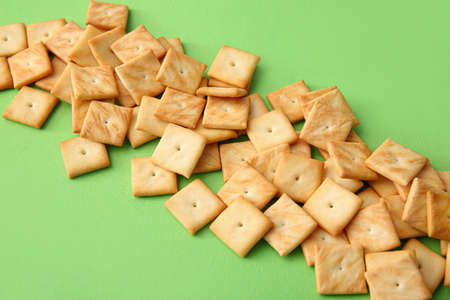 Tasty crackers on color background, closeupの写真素材