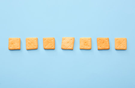 Tasty crackers on color backgroundの写真素材