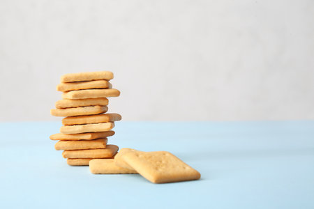 Stack of tasty crackers on tableの写真素材