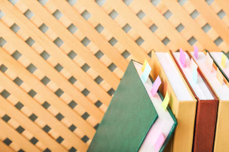 Many books with bookmarks on color backgroundの写真素材