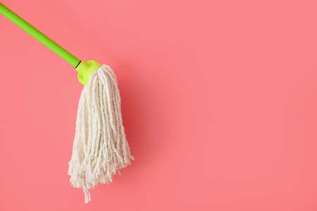 Floor mop on color background